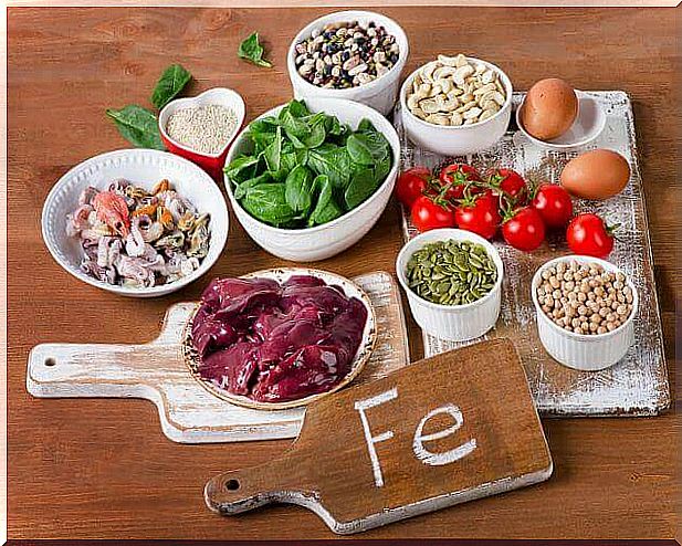Healthy foods and a sign with Fe, the chemical name for iron