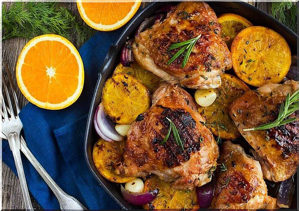 Delicious baked chicken with orange and rosemary