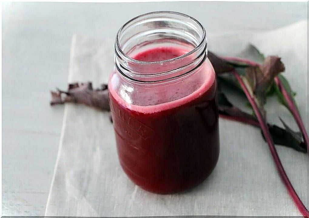 Glass jar with beetroot juice